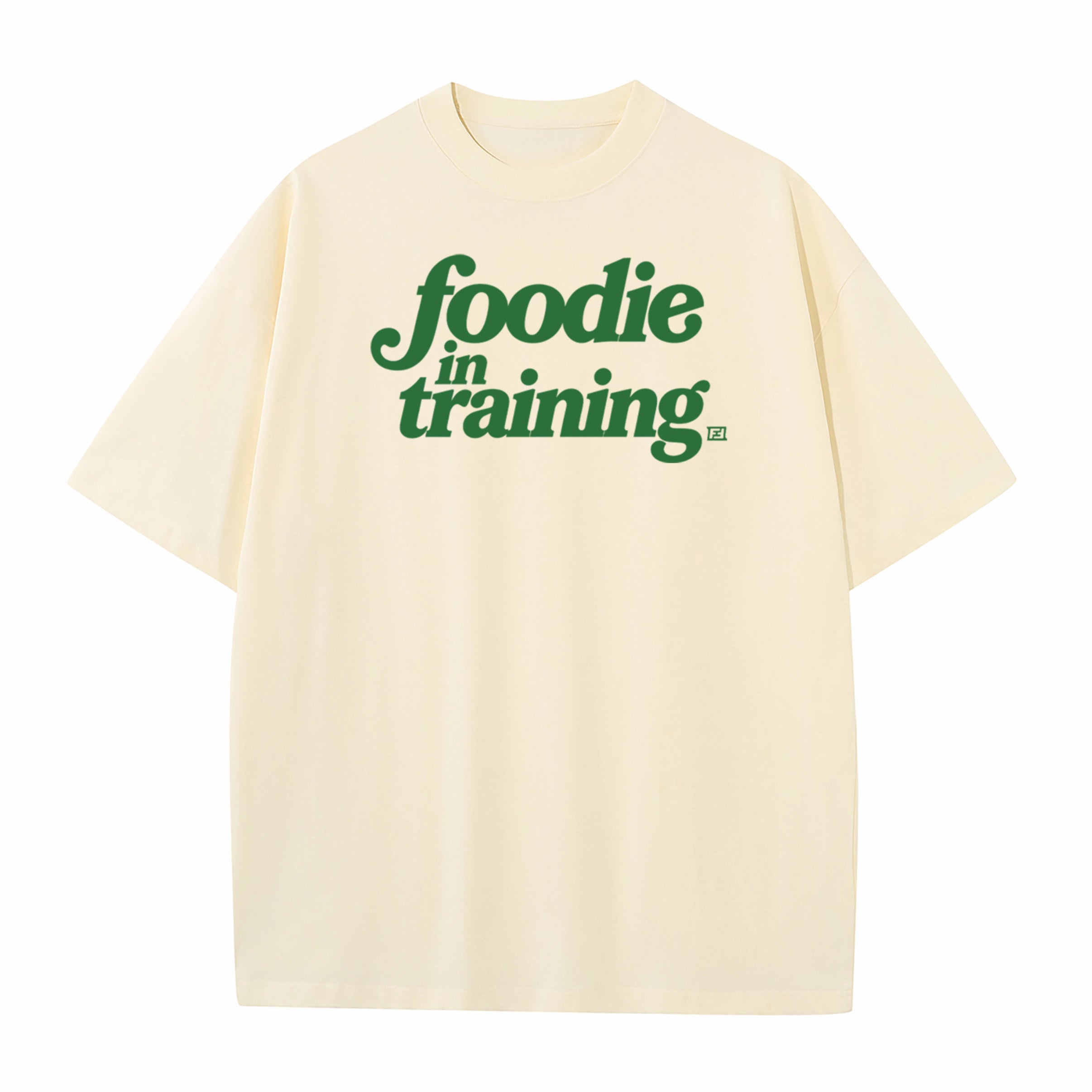 “foodie in training” Cream T-Shirt