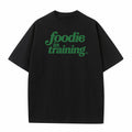 “foodie in training” Black T-Shirt